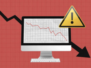 Graphic of a computer screen with a falling line chart and caution sign indicating a website traffic drop.