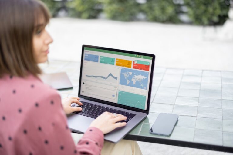 Small-business owner using Google tools to track website performance, local search visibility, and customer activity.